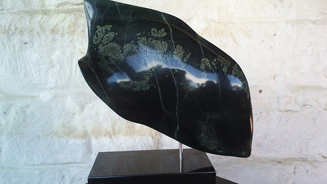 Iridescent Angel, serpentine stone by Andr Roodt