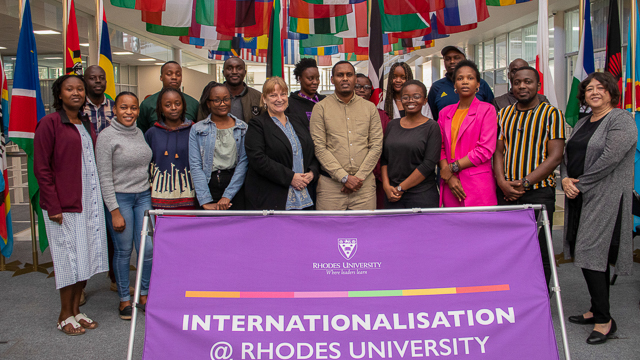 Mr Adan Mohamed Ibrahim stands with his team, the International Office staff members and Kenyan students at Rhodes University
